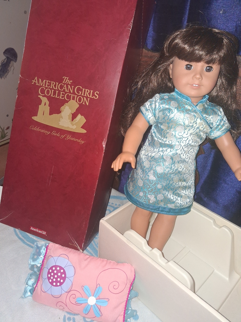 American Girl Brown-Haired Doll in Turquoise Brocade Dress with Pink Pillow